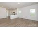 Bright, open-concept living room with light wood floors and ample natural light at 1630 Troon Dr, Salisbury, NC 28144