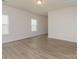 Bright living room with natural light and neutral finishes, ready for personalization at 1630 Troon Dr, Salisbury, NC 28144