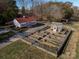 Property features a barn, greenhouse, and a unique garden at 172 Tuckertown Rd, New London, NC 28127