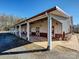 Modern barn with covered stalls and brick pavers; equestrian property at 172 Tuckertown Rd, New London, NC 28127