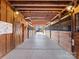 Spacious barn aisle with multiple stalls; well-maintained equestrian facility at 172 Tuckertown Rd, New London, NC 28127
