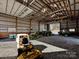 Barn with various farm equipment and machinery at 172 Tuckertown Rd, New London, NC 28127
