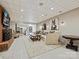 Spacious basement recreation area with comfortable seating and a kitchen at 172 Tuckertown Rd, New London, NC 28127