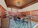 Elegant dining room with wood wall paneling and chandelier at 172 Tuckertown Rd, New London, NC 28127