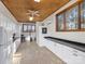 Dog washing station with white cabinets and a built-in kennel at 172 Tuckertown Rd, New London, NC 28127