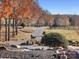 Long driveway leading to home with autumn trees at 172 Tuckertown Rd, New London, NC 28127