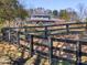 Brick home with a long private driveway and wooden fence at 172 Tuckertown Rd, New London, NC 28127