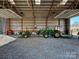 Spacious garage with ample room for tractors and other equipment at 172 Tuckertown Rd, New London, NC 28127