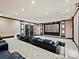 Elegant home theater with comfortable seating and a large projection screen at 172 Tuckertown Rd, New London, NC 28127