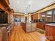 Spacious kitchen featuring hardwood floors and an island at 172 Tuckertown Rd, New London, NC 28127