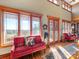 Spacious living room with large windows and red sofa at 172 Tuckertown Rd, New London, NC 28127