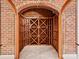 Custom wine cellar with brick walls and wooden racks at 172 Tuckertown Rd, New London, NC 28127