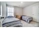 Bright bedroom with two twin beds, a chair, and window coverings at 202 Brentwood Dr, Statesville, NC 28625