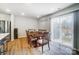 Dining area with hardwood floors, wooden table and access to backyard at 202 Brentwood Dr, Statesville, NC 28625