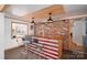 Bar with a custom wood bar, including an American Flag design, pendant lights, and seating at 2073 Mauney Rd, Bessemer City, NC 28016