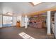 Finished basement featuring brick accent wall, bar with American flag, and backyard walkout at 2073 Mauney Rd, Bessemer City, NC 28016