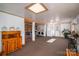 Finished basement with ample space, including exposed beams, a bar area, laundry, and furniture at 2073 Mauney Rd, Bessemer City, NC 28016