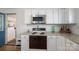 Kitchen showcasing modern appliances, white cabinetry, and sleek countertops at 2073 Mauney Rd, Bessemer City, NC 28016