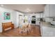 Spacious kitchen featuring white cabinets, modern appliances, and a dining table at 2073 Mauney Rd, Bessemer City, NC 28016