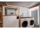 Laundry room featuring a washer, dryer, and shelving for storage at 2073 Mauney Rd, Bessemer City, NC 28016