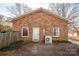 Brick house exterior with white door and AC unit at 2111 Greenleaf Dr, Gastonia, NC 28054