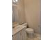 Bathroom with toilet, sink, and cabinet at 2121 Carriage Woods Ln, Kannapolis, NC 28081