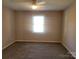 Bright bedroom featuring neutral walls, carpet flooring and a window at 2121 Carriage Woods Ln, Kannapolis, NC 28081