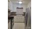 Kitchen featuring modern appliances, white cabinetry, and tile flooring for a clean, updated look at 2121 Carriage Woods Ln, Kannapolis, NC 28081