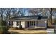 Newly built house with gray siding, black shutters, and a gray roof at 2617 Mcarver St, Gastonia, NC 28052