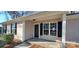 Inviting front porch with black shutters and a storm door at 2617 Mcarver St, Gastonia, NC 28052