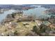 Aerial view of home with paved driveway and proximity to the lake at 3745 Dockside Ln, Sherrills Ford, NC 28673