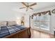 Inviting bedroom showcases hardwood floors, a ceiling fan, and natural light at 3745 Dockside Ln, Sherrills Ford, NC 28673