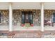 Inviting front porch with stone accents, plants, and a cozy bench at 3745 Dockside Ln, Sherrills Ford, NC 28673