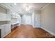 Spacious home office with built-in shelving and hardwood floors at 3788 Panthers Den Ct, Concord, NC 28027