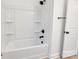 Bathroom with a shower/tub combo and white fixtures at 408 N Boyd St, Gastonia, NC 28052