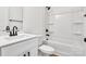 Clean bathroom with white vanity, bathtub, and shower at 408 N Boyd St, Gastonia, NC 28052