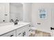Clean bathroom with white vanity and bathtub at 408 N Boyd St, Gastonia, NC 28052