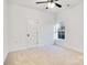 Spacious bedroom with a window and ceiling fan at 408 N Boyd St, Gastonia, NC 28052