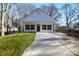 Newly built home with a concrete driveway and grassy lawn at 408 N Boyd St, Gastonia, NC 28052