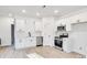 Modern white kitchen with stainless steel appliances at 408 N Boyd St, Gastonia, NC 28052