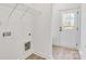 Laundry room with built in shelving and exterior access at 408 N Boyd St, Gastonia, NC 28052