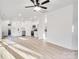 Open concept living space with kitchen and hardwood floors at 408 N Boyd St, Gastonia, NC 28052