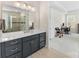 Modern bathroom with dark vanity, walk-in shower, and stylish fixtures at 4219 Moxie Way, Charlotte, NC 28215