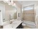 Clean bathroom with a shower/tub combo and dark vanity at 4219 Moxie Way, Charlotte, NC 28215