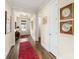 Bright entryway with hardwood floors and a red runner at 4219 Moxie Way, Charlotte, NC 28215