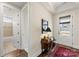 Light and airy entryway with hardwood floors and access to a bathroom at 4219 Moxie Way, Charlotte, NC 28215