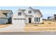 Two-story house with white siding, gray shutters, and a two-car garage at 4219 Moxie Way, Charlotte, NC 28215
