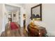 Long hallway with hardwood floors and a red runner at 4219 Moxie Way, Charlotte, NC 28215
