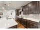 Modern kitchen with dark cabinetry, quartz countertops and stainless steel appliances at 4219 Moxie Way, Charlotte, NC 28215