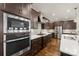 Modern kitchen with stainless steel appliances and dark wood cabinetry at 4219 Moxie Way, Charlotte, NC 28215